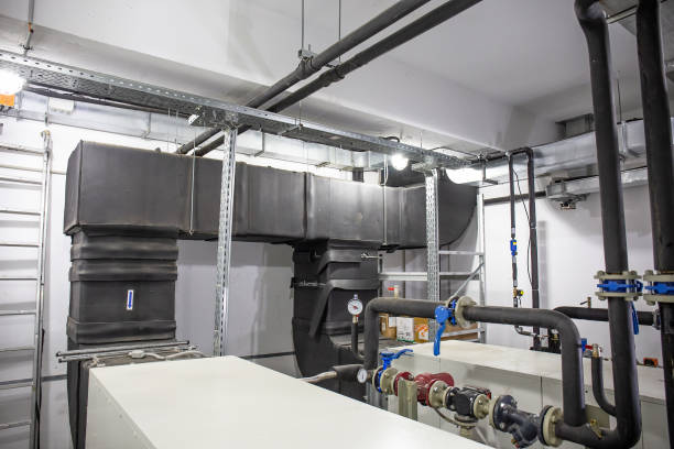 istock Industrial building ventilation system with bog steel pipes in control room 1071233150