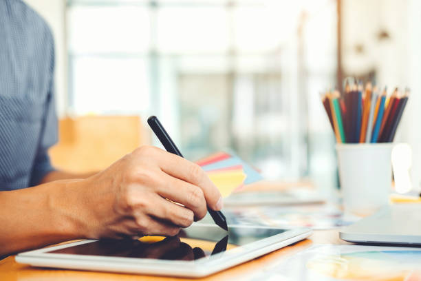 istock Graphic designer Brainstorming drawing on graphics tablet at workplace 1071237988
