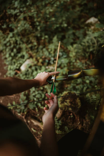 istock Young female archer getting ready to  fire her arrows 1071241068