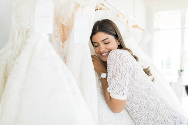 istock Young Bride Cuddling Her Wedding Dress 1071242614