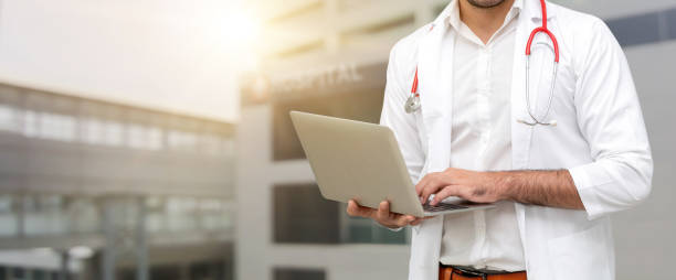 istock Doctor using laptop computer at the hospital. 1071249178