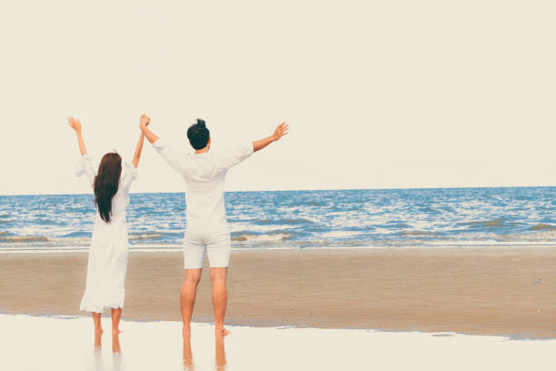 istock Couple going honeymoon on tropical beach in summer 1071249352
