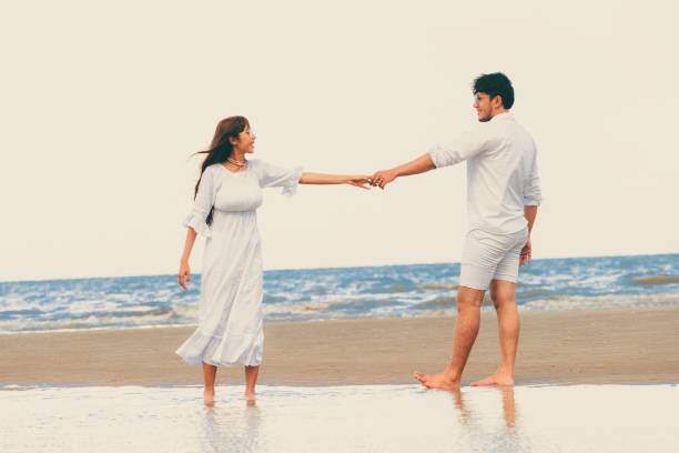 istock Couple going honeymoon on tropical beach in summer 1071249372