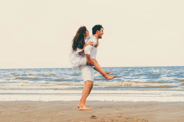 istock Couple going honeymoon on tropical beach in summer 1071249374
