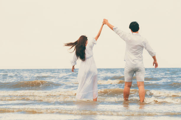 istock Couple going honeymoon on tropical beach in summer 1071249438