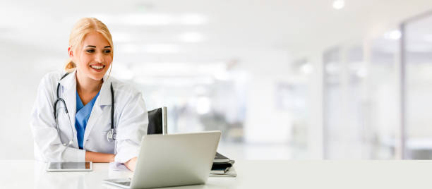 istock Doctor using laptop computer at the hospital. 1071252336