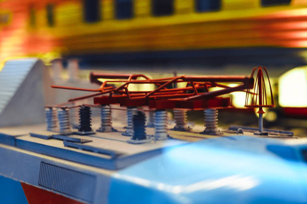 Miniature toy model of modern train crossing bridge