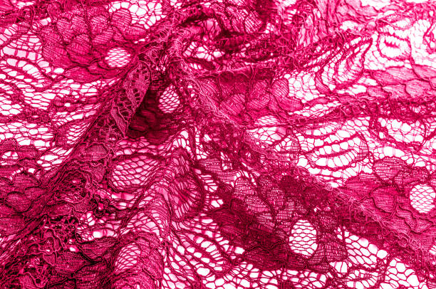 istock Texture, background, pattern. Cloth red lace. Background of fabric from lace stylized roses. Abstract lace pattern with flowers. Wallpaper, underwear and jewelry. Your invitations 1071269896