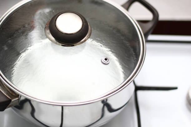 istock Sauce Pot with Glass Lid with boiling water 1071280434