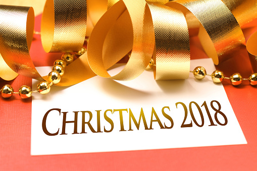 Merry Christmas 2018 with gold decoration. Wishing you wonderful memories during this joyous season.