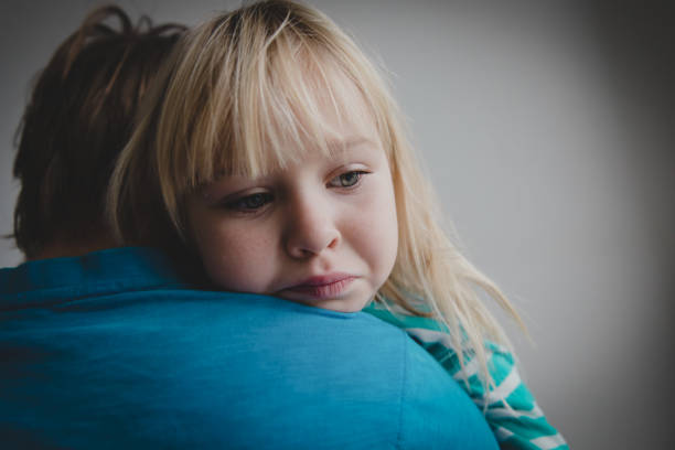 istock father comforting stressed sad daughter, parenting, support 1071287462