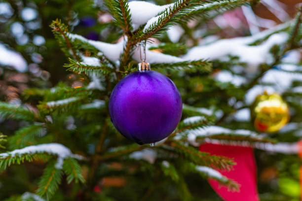 istock Fir branches in the snow with Christmas decorations 1071287594