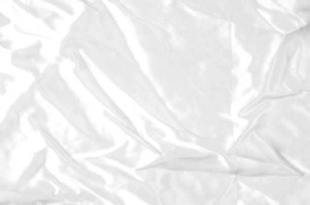 istock Texture, background, pattern. White silk fabric, Smooth elegant white silk or satin fabric fabric can be used as a wedding background. Luxury Christmas background or New Year background design 1071291248