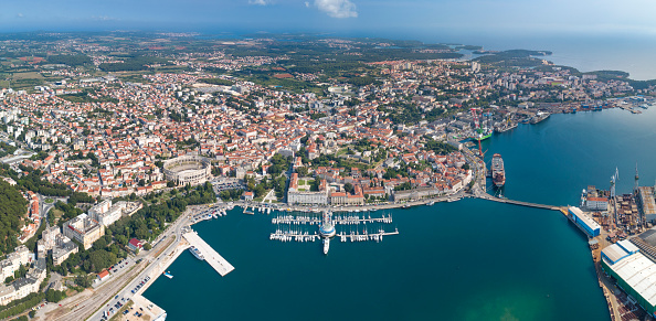 Aerial of the beautiful city Pula with its famous Arena Amphitheater, Marina and Harbor, Croatia. Converted from RAW.
