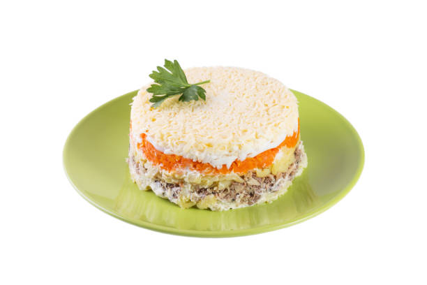istock Layered salad with eggs and fish on the white background 1071297206