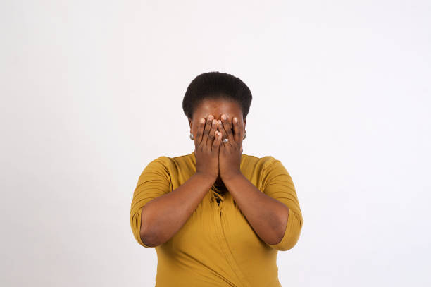 istock Beautiful African woman deep etch shy hiding 1071303994