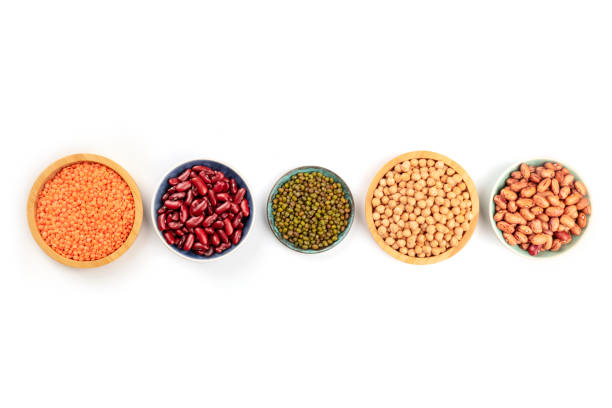 istock Various types of legumes, shot from above on a white background with copy space. Different beans, lentil, chickpea, soybeans 1071305098