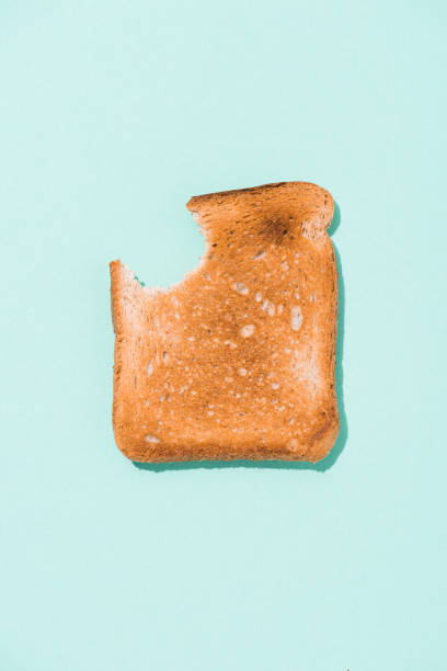 istock top view of bitten crunchy toast on blue surface 1071313404