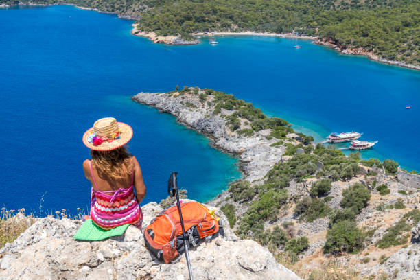 istock Lady tourist taking a break, watching the sea. 1071313994