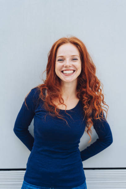 istock Friendly young woman with a vivacious smile 1071318336