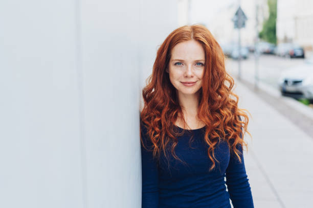 istock Friendly attractive young redhead woman 1071318592
