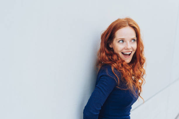 istock Young redhead woman with an excited expression 1071318600