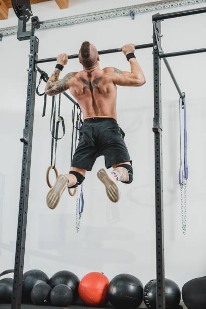 istock Man doing muscle ups at the gym 1071318650