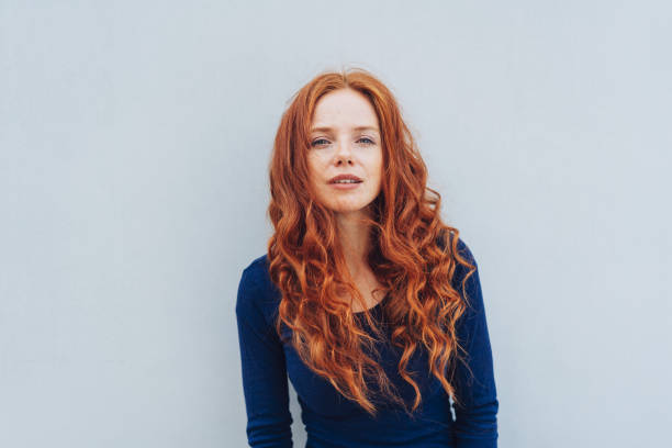 istock Young woman scrutinising the camera intently 1071319978