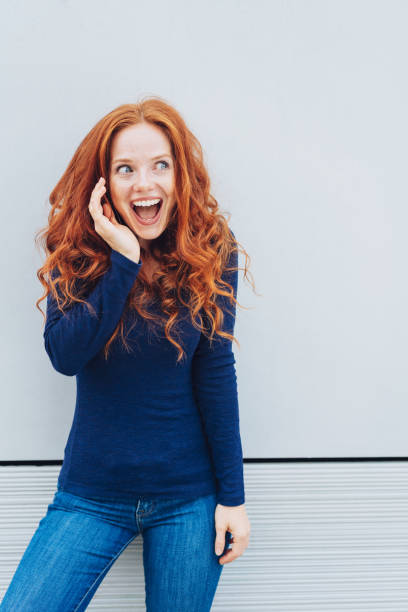 istock Excited young woman looking off to the side 1071320088
