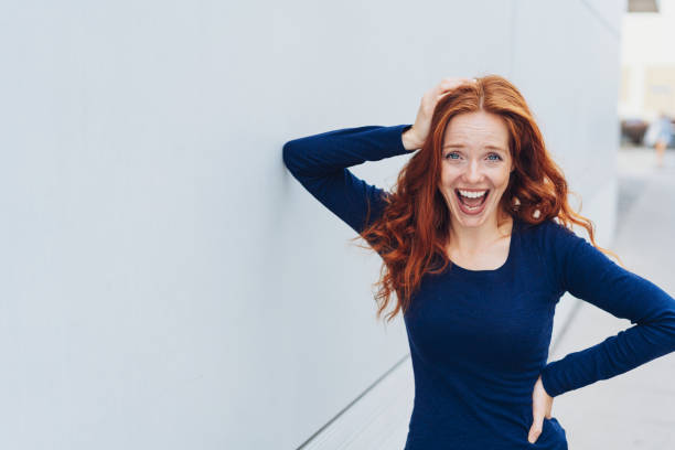 istock Laughing relaxed young woman enjoying a joke 1071320362