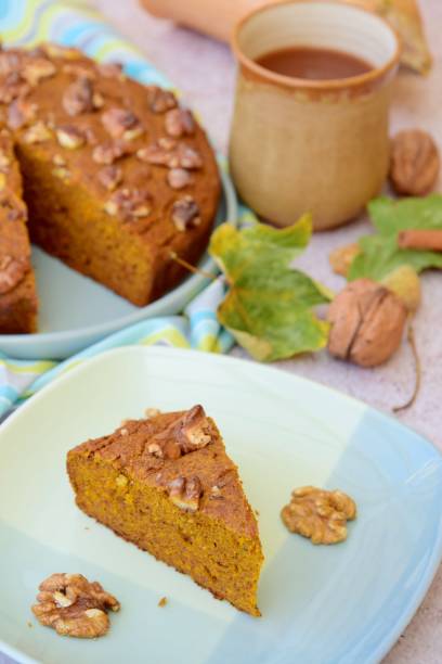 istock Pumpkin cinnamon walnut cake with hot chocolate drink 1071322732