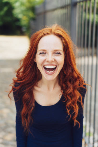 istock Pretty vivacious woman enjoying a good laugh 1071323392