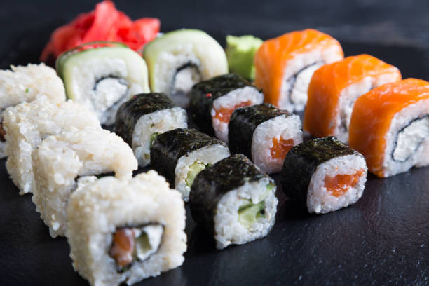 istock A variety of sushi and rolls on a dark background 1071325536