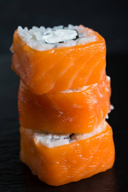 istock A variety of sushi and rolls on a dark background 1071325820