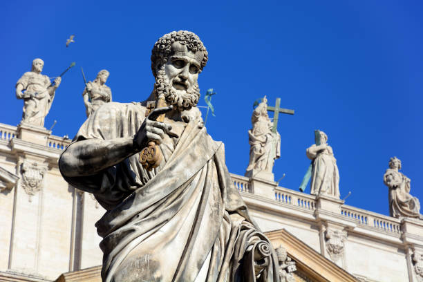 Saint Peter holding a key Statue of Saint Peter holding a key on St. Peter's Square in Vatican peter the apostle stock pictures, royalty-free photos & images