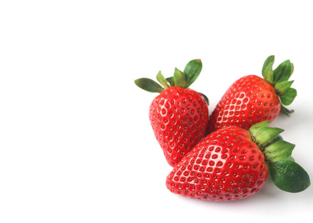istock Three Bright Color Red Fresh Ripe Strawberries Isolated on White Background with Free Space for Design or Text 1071327222