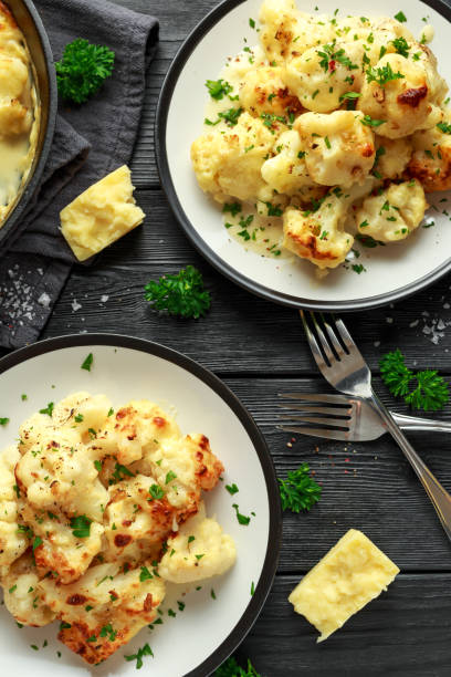 istock Roasted cauliflower with cheddar cheese sauce and herbs. 1071328452