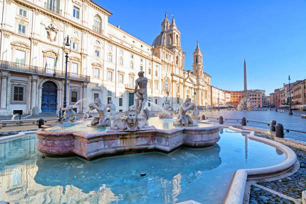 Piazza Navona at sunrise, Rome The Fontana del Moro (Moor Fountain) at Piazza Navona in Rome, Italy fontana del moro stock pictures, royalty-free photos & images