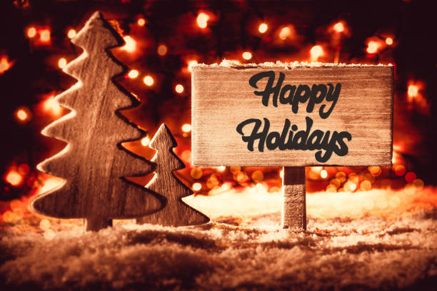 istock Sign, Tree, Snow, Calligraphy Happy Holidays, Snowflakes, Red Spotlight 1071333680