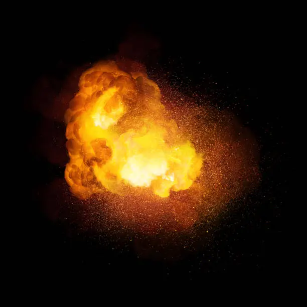 Photo of Fiery bomb explosion, orange color with sparks and smoke isolated on black background