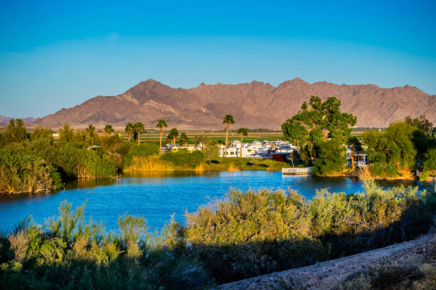 The famous Yuma Lakes in Yuma, Arizona A large refreshing lake with a background silhouette of the mountain in Southwest Arizona yuma photos stock pictures, royalty-free photos & images
