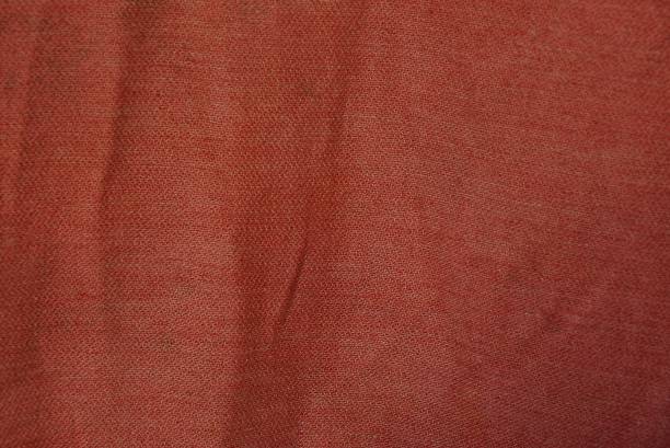 istock red fabric texture from a piece of crumpled matter on clothes 1071338016