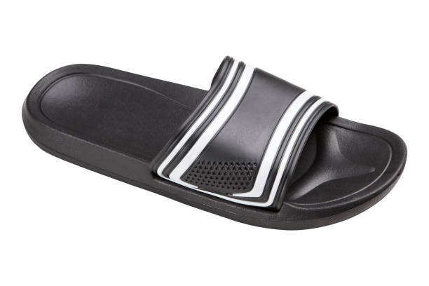 istock one black slipper for a pool or shower, side view, on a white background, isolate 1071341534
