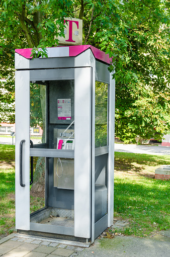 Gera, Germany - September, 2.  2012. telephone booth of the Telekom in the typical magenta color.