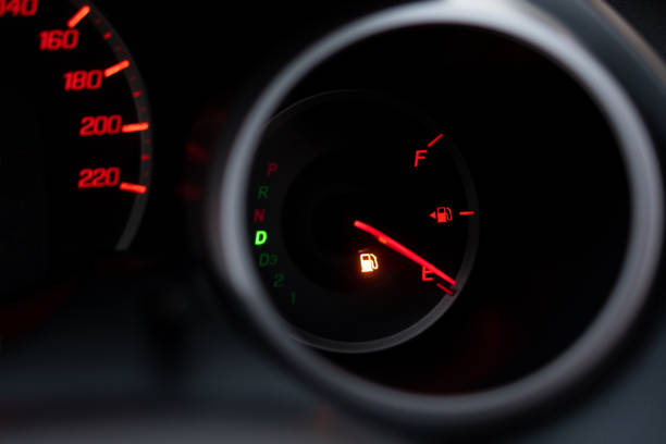 the car dashboard shows the flue gas with red. the oil warning light is running out.close up image of illuminated car dashboard - flue gas imagens e fotografias de stock