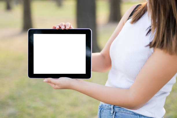 istock Woman holding digital tablet 1071351612