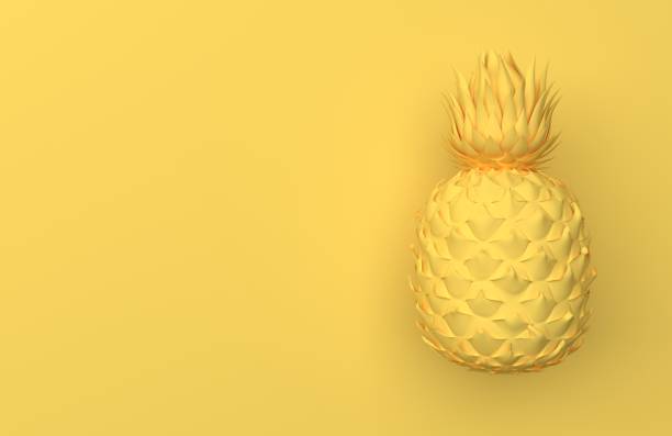 istock One yellow pineapple isolated on a yellow background with space for text. 1071352866
