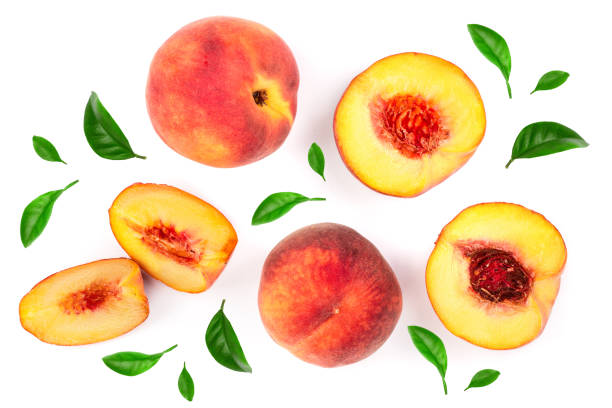 istock ripe peaches with leaves isolated on white background. Top view. Flat lay pattern 1071354536