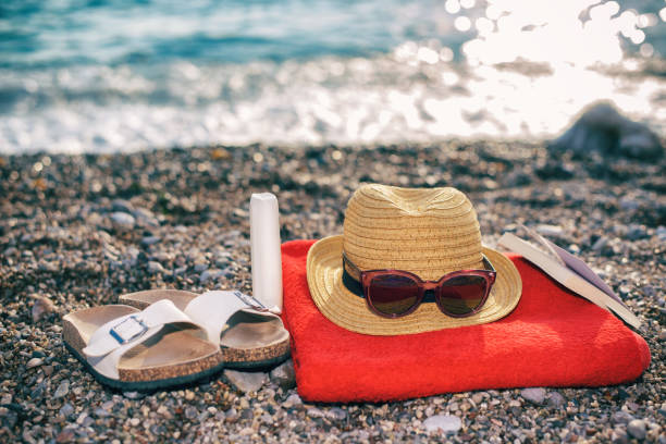 istock Beach accessories in the sand against 1071355968