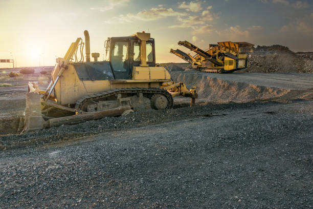 istock Excavator working in a quarry with rock 1071358924